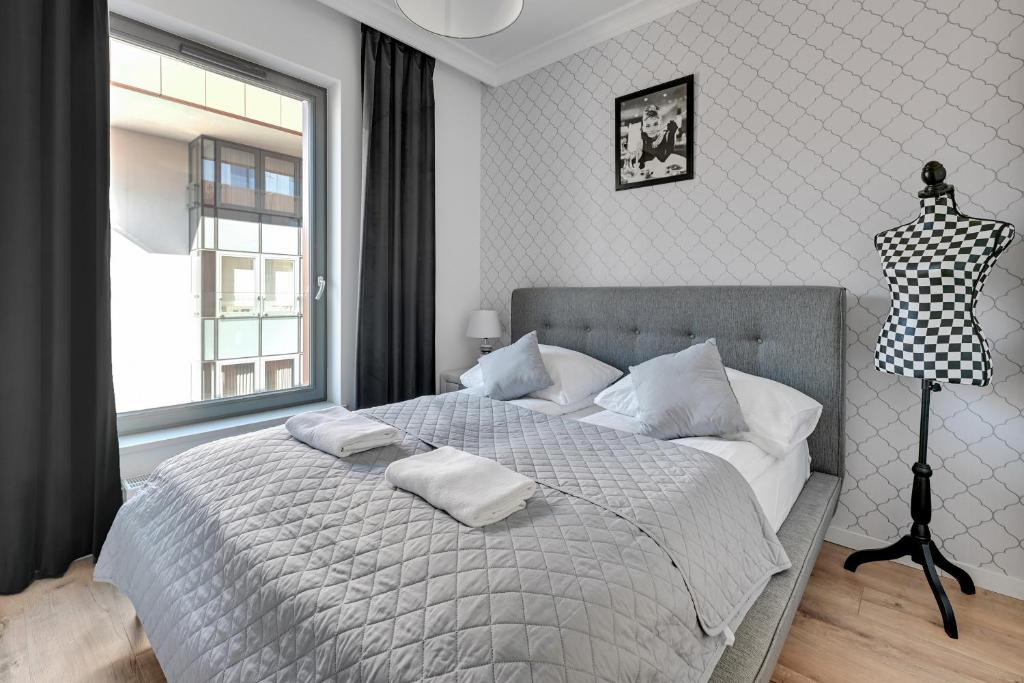 Posteľ alebo postele v izbe v ubytovaní Grand Apartments - Brabank Apartments
