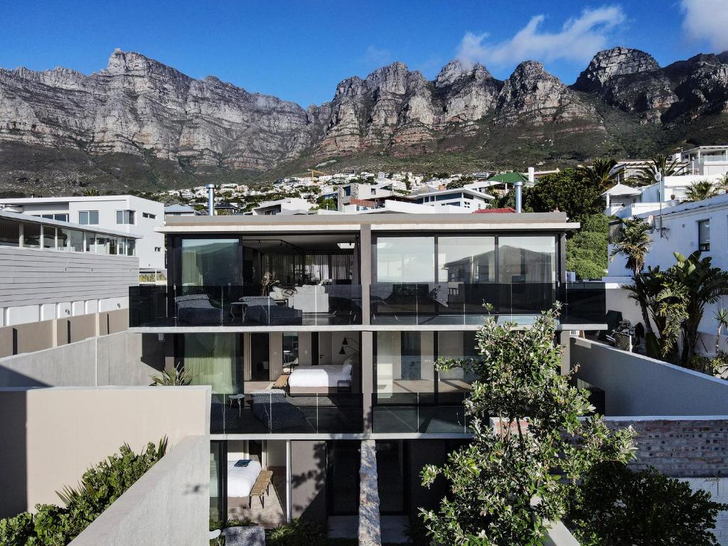 a house with a view of the mountains at Villa Pietra - Camps Bay in Cape Town