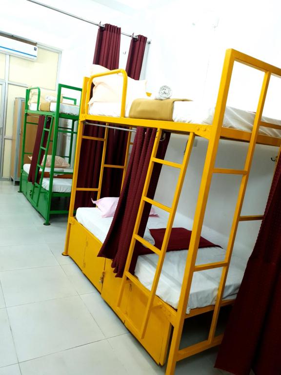 Postel nebo postele na pokoji v ubytování Chez Prabha Homestay