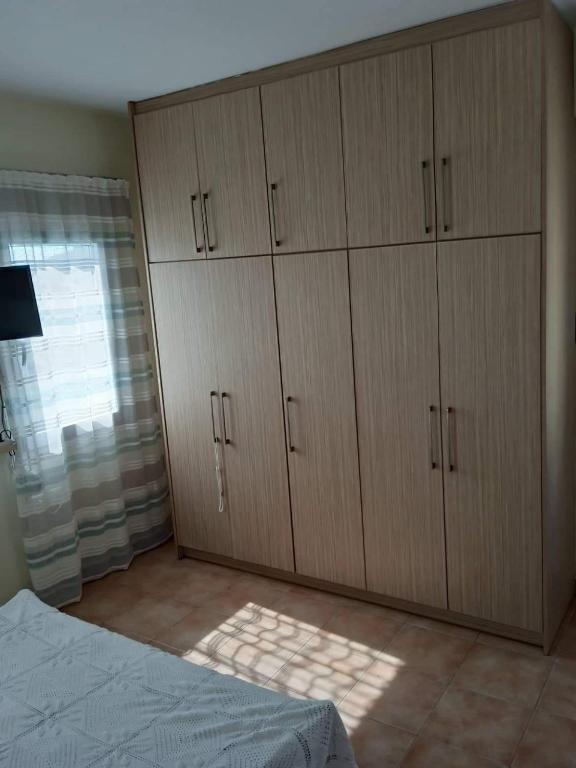 Postel nebo postele na pokoji v ubytování Leros 'Sundown' Guest house