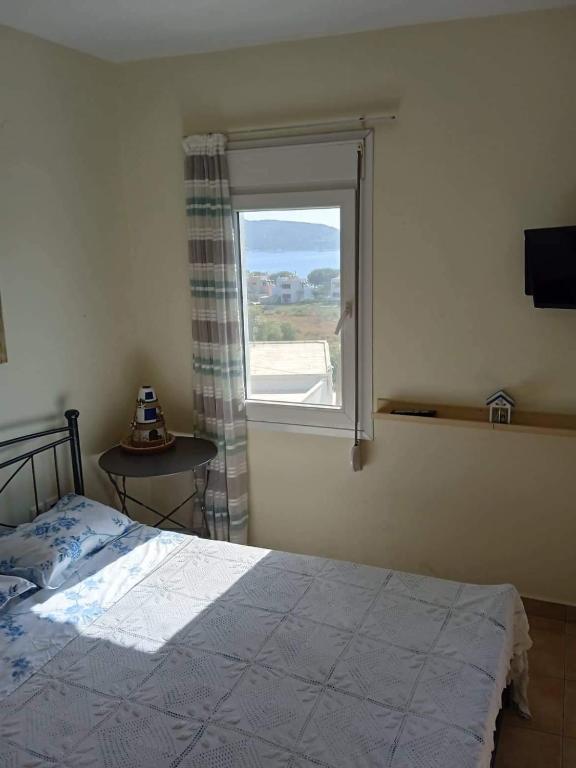 Postel nebo postele na pokoji v ubytování Leros 'Sundown' Guest house