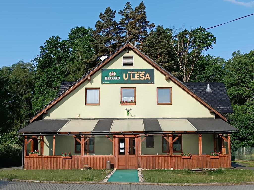 a building with a usa sign on it at Restaurace a Penzion U Lesa in Havířov