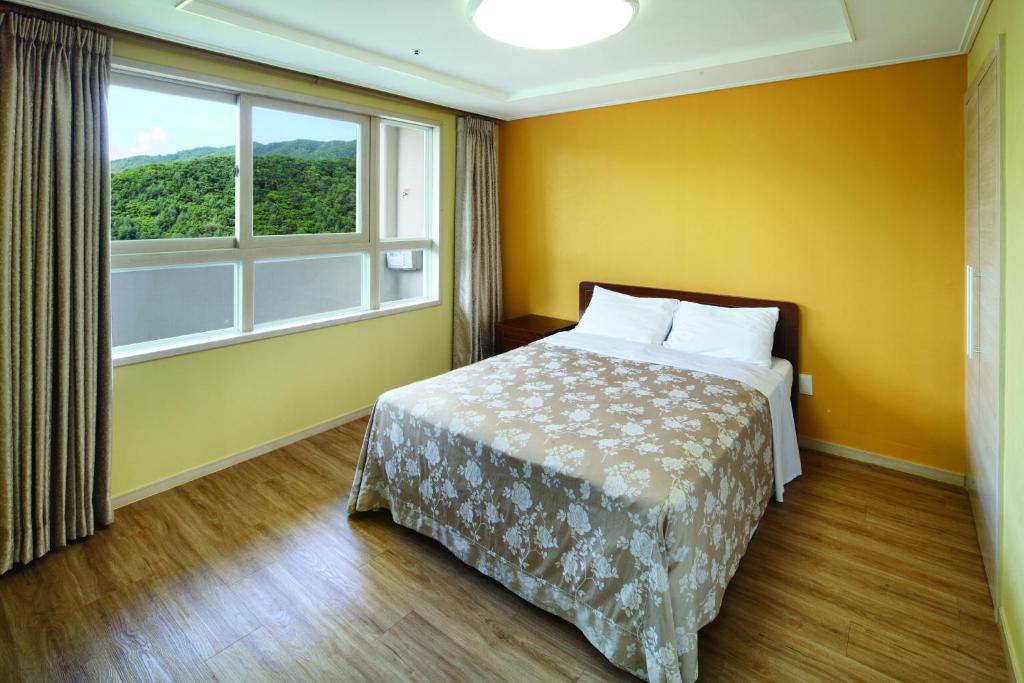 Postel nebo postele na pokoji v ubytování Hanwha Resort Pyeongchang