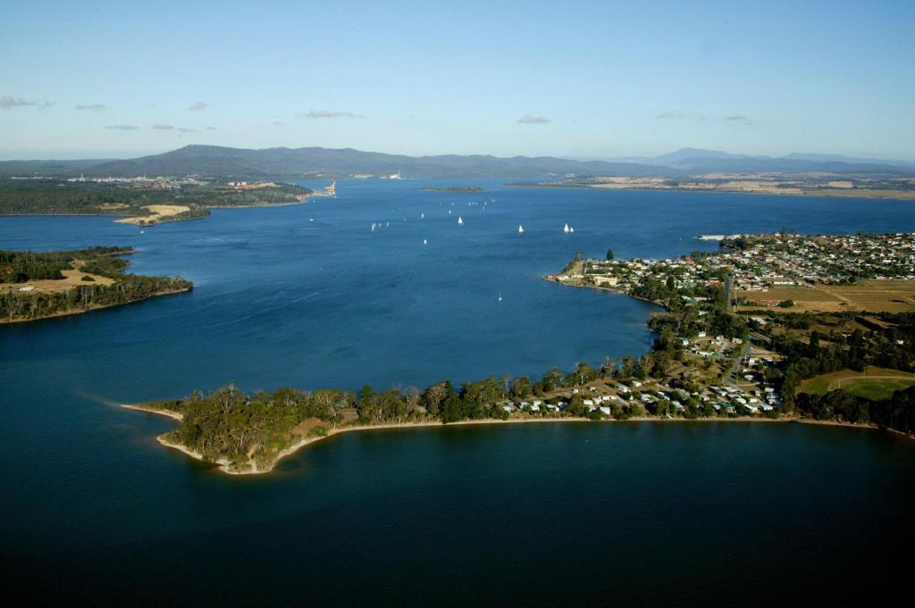 an island in the middle of a large body of water at Beauty Point Tourist Park in Beauty Point