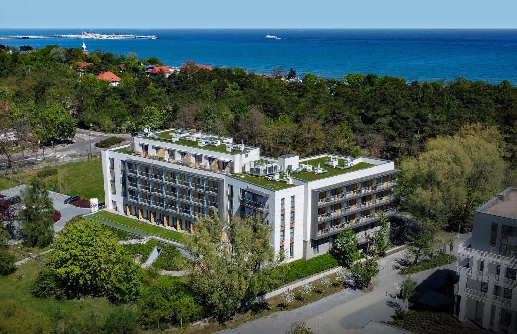 an aerial view of a building with the ocean in the background at Sopotorium Hotel & Medical Spa in Sopot
