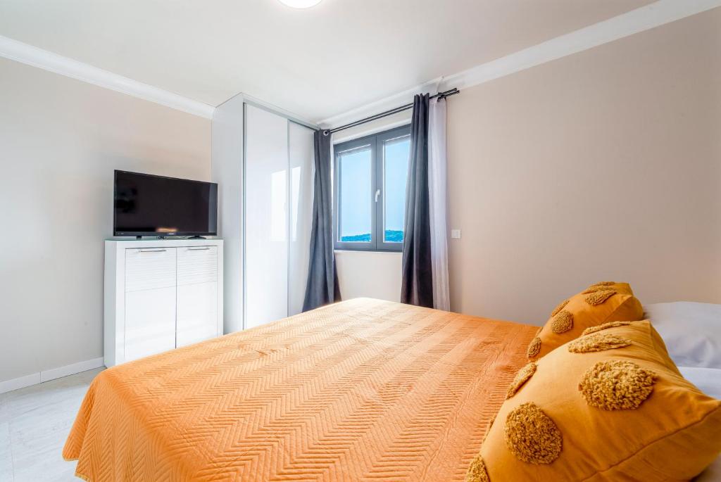 Postel nebo postele na pokoji v ubytování Apartman MaKris No3