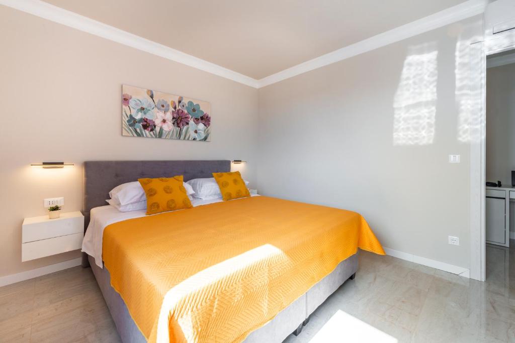 Postel nebo postele na pokoji v ubytování Apartman MaKris No3