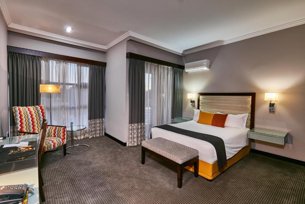 Postel nebo postele na pokoji v ubytování Regent Select Hotel