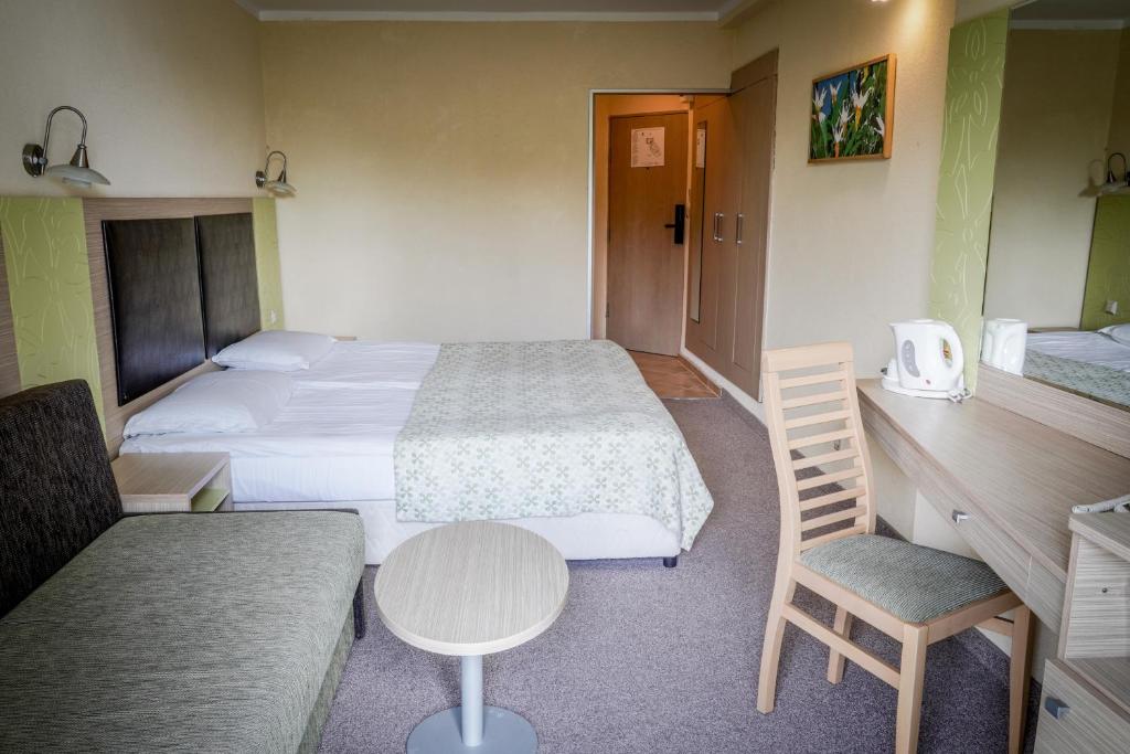 Кровать или кровати в номере Hotel Gergana - Ultra All Inclusive