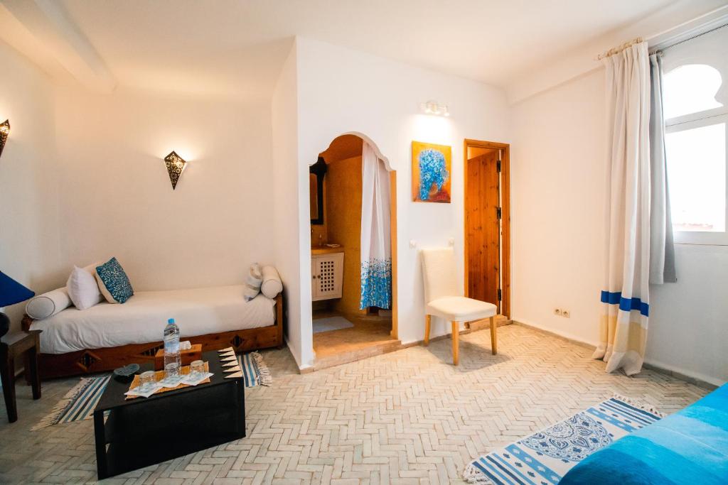 Postel nebo postele na pokoji v ubytování Dar Liouba Hotel