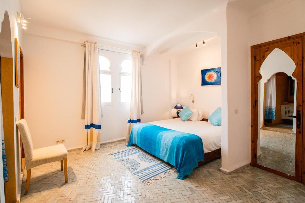 Postel nebo postele na pokoji v ubytování Dar Liouba Hotel