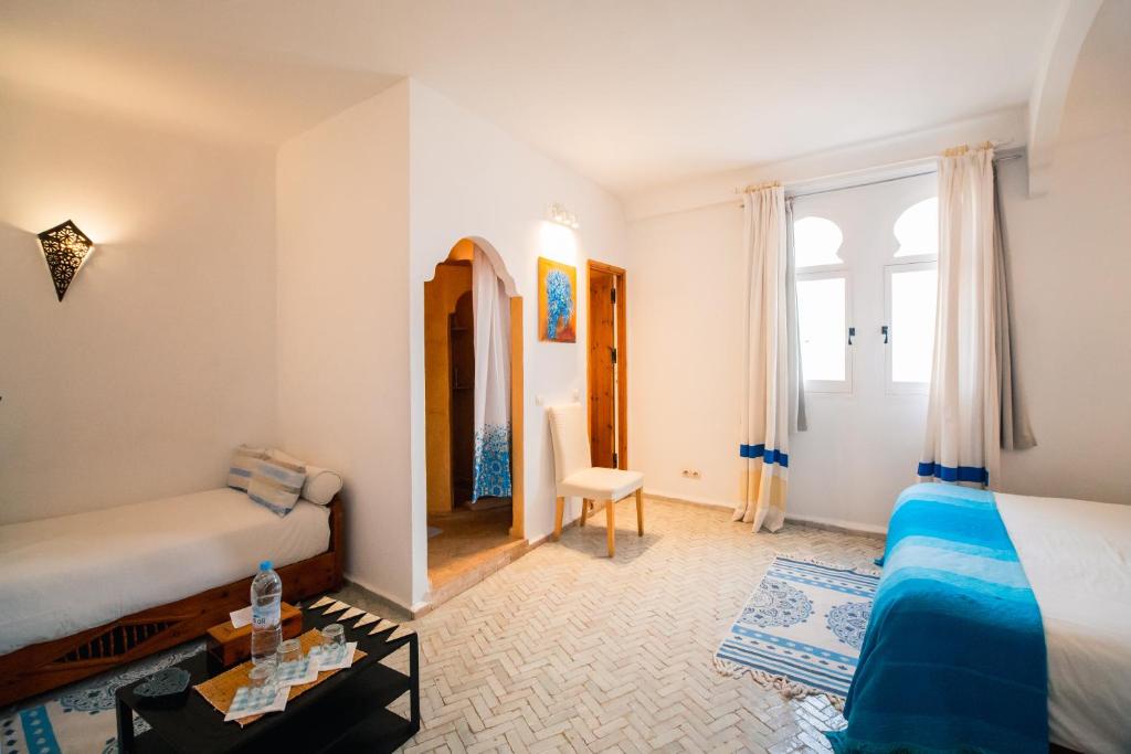 Postel nebo postele na pokoji v ubytování Dar Liouba Hotel