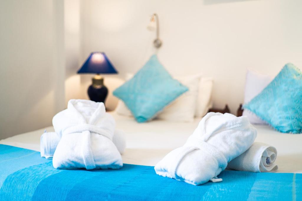 Postel nebo postele na pokoji v ubytování Dar Liouba Hotel