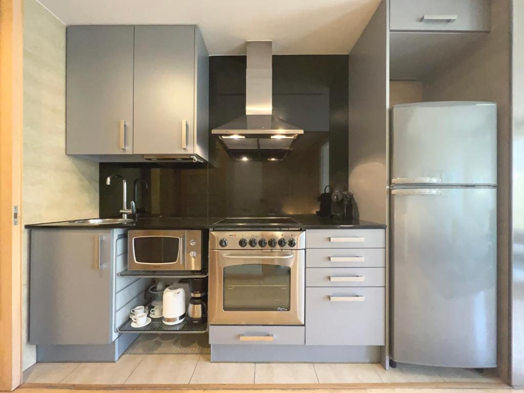 Kuchyň nebo kuchyňský kout v ubytování Stay U-nique Apartments Venecuela