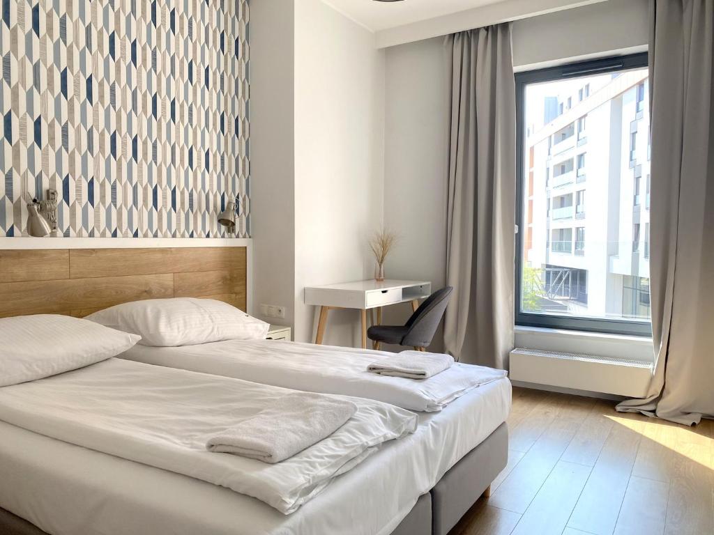 Posteľ alebo postele v izbe v ubytovaní Grand Apartments - Brabank Apartments