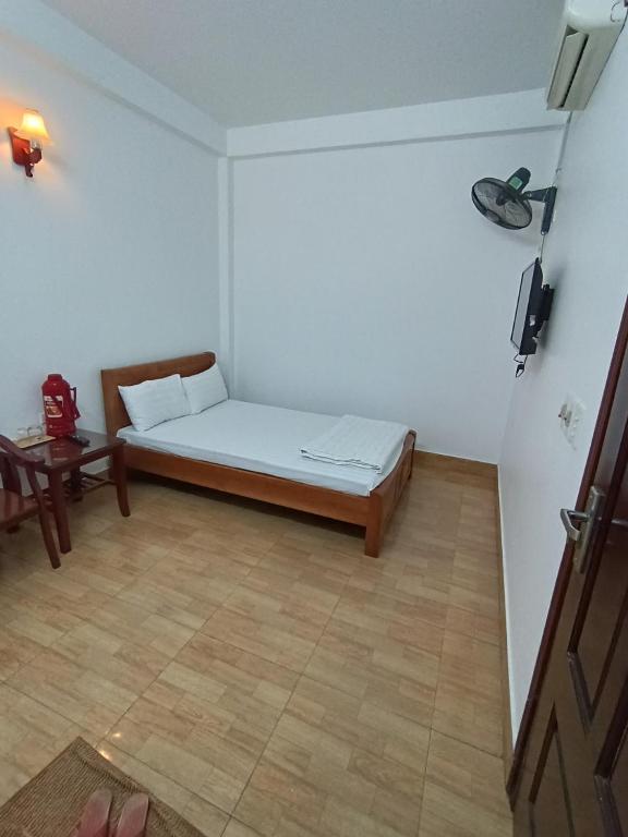 Postel nebo postele na pokoji v ubytování Anh Duong Hotel