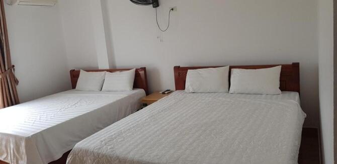 Postel nebo postele na pokoji v ubytování Anh Duong Hotel