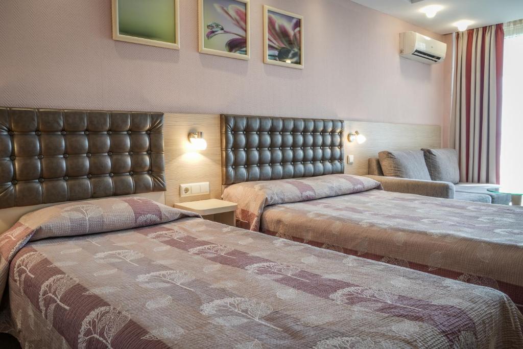 Postel nebo postele na pokoji v ubytování Hotel Sandy Beach