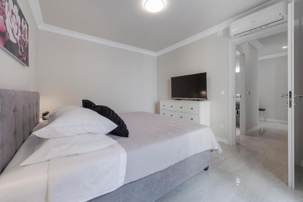 Postel nebo postele na pokoji v ubytování Apartman MaKris No 4