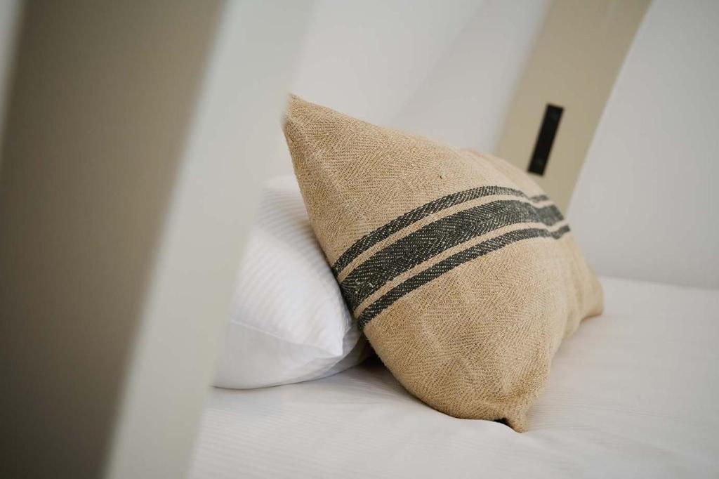 Postel nebo postele na pokoji v ubytování Hello I'm Local - Boutique Hostel