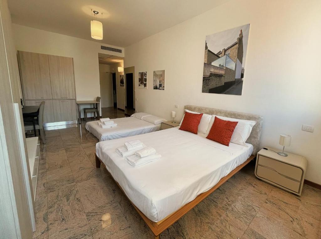 A bed or beds in a room at Ego' Residence Ferrara