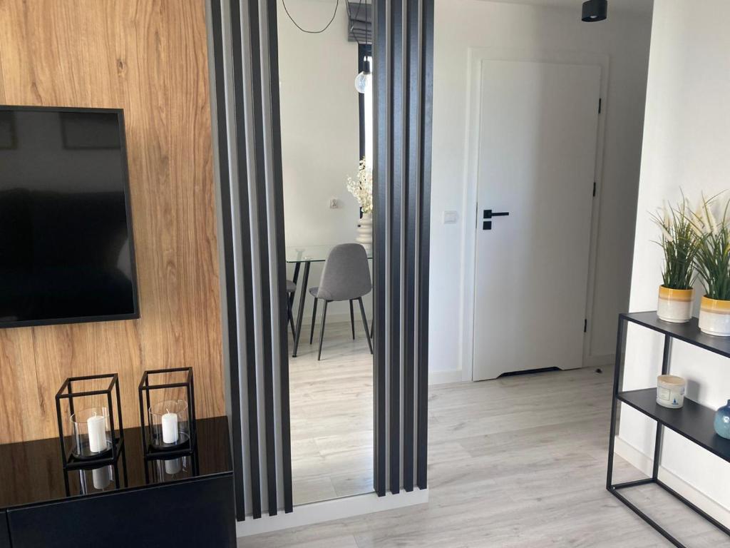 Televízia a/alebo spoločenská miestnosť v ubytovaní Apartament LOFT 74 Z Widokiem Na Morze - 365PAM