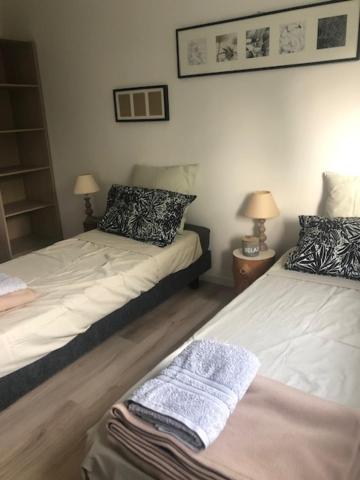 Posteľ alebo postele v izbe v ubytovaní maison de charme avec jardin,pacé,proche de Rennes