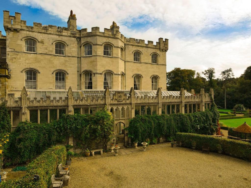 a large building with a garden in front of it at The Castle By Group Retreats in Hartlepool