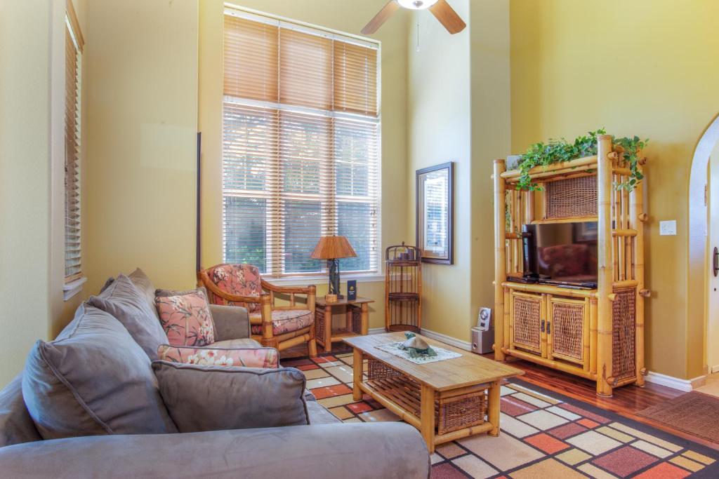 a living room with a couch and a table at Waikoloa Colony Villas 2706 in Waikoloa