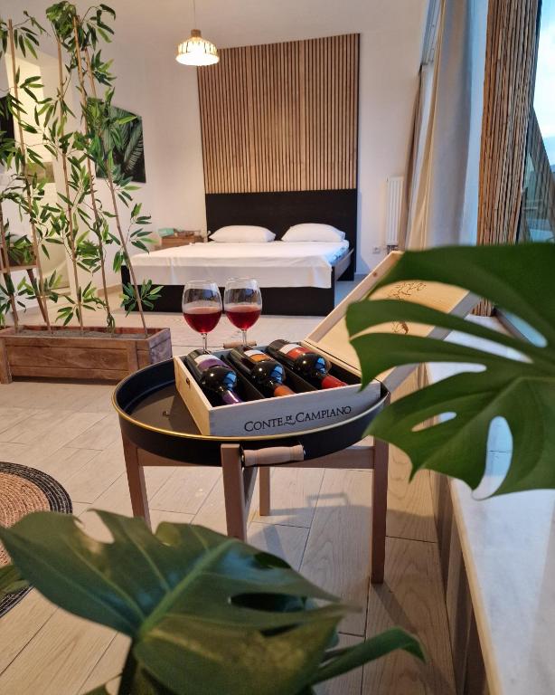 two glasses of wine on a table in a living room at Bodega Otel Şile in Şile