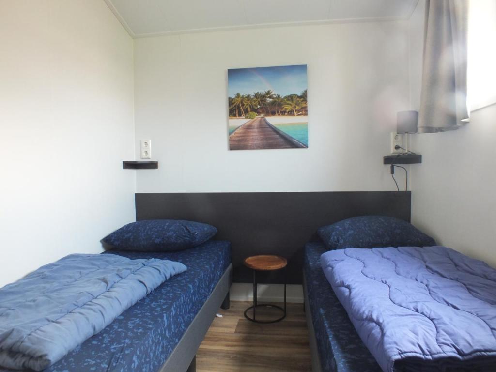 Postel nebo postele na pokoji v ubytování Camping de Vogel
