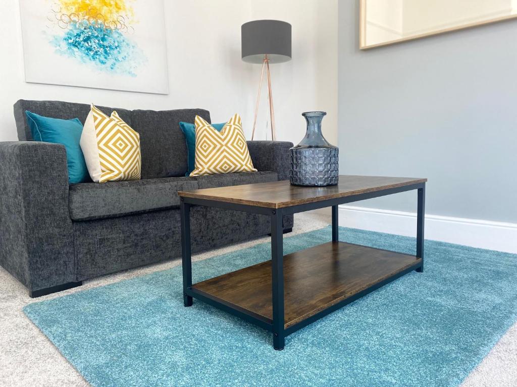 a living room with a couch and a coffee table at Stanhope Road in South Shields