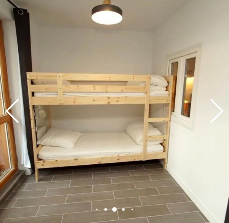 a room with a bunk bed with pillows at Deux Alpes - Résidence aux pieds des pistes -8 pers in Les Deux Alpes