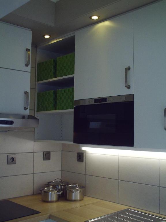 Kuchyň nebo kuchyňský kout v ubytování Apartment Capitalcondos