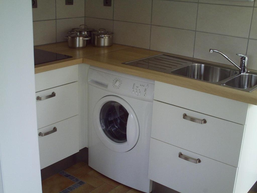 Kuchyň nebo kuchyňský kout v ubytování Apartment Capitalcondos