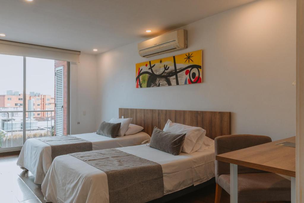 Postel nebo postele na pokoji v ubytování Travelers Orange Suites