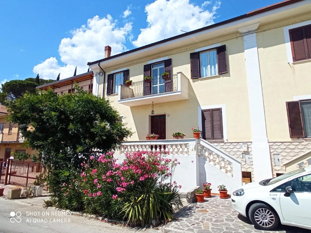 a white car parked in front of a house at Interstellar in Aielli