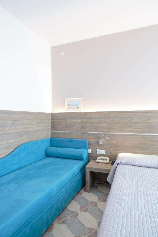 Postel nebo postele na pokoji v ubytování Hotel Capri 3 Stelle SUPERIOR