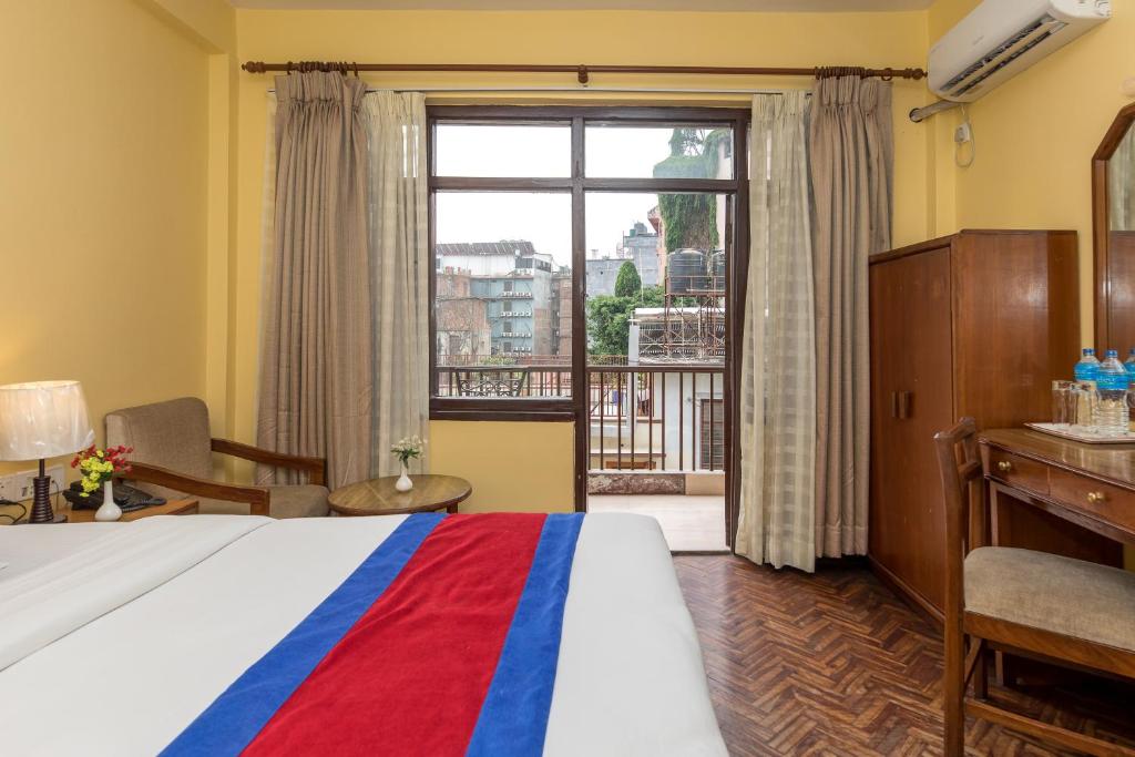 Postel nebo postele na pokoji v ubytování Hotel Thamel