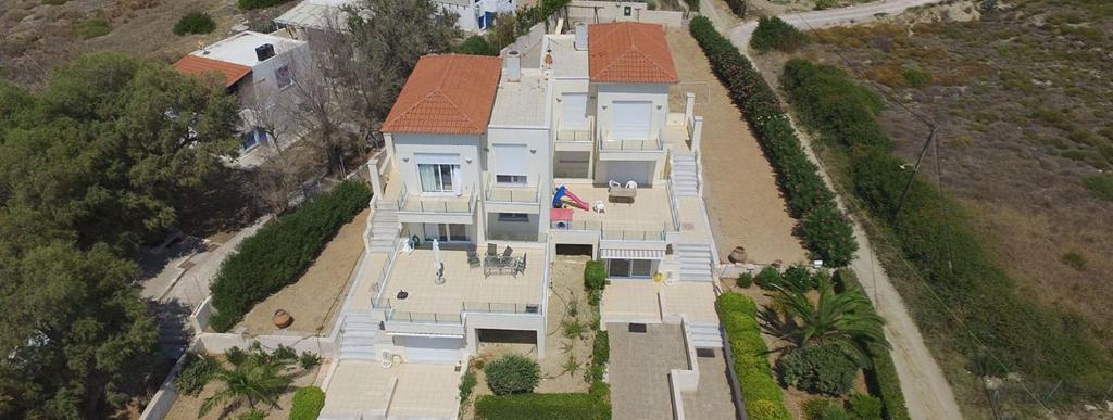 an overhead view of a large house on a hill at KomiVillas in Lilikás