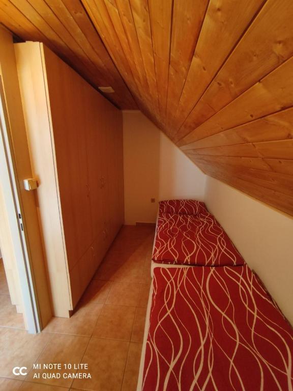 Voodi või voodid majutusasutuse Vinařství Ehrlich toas