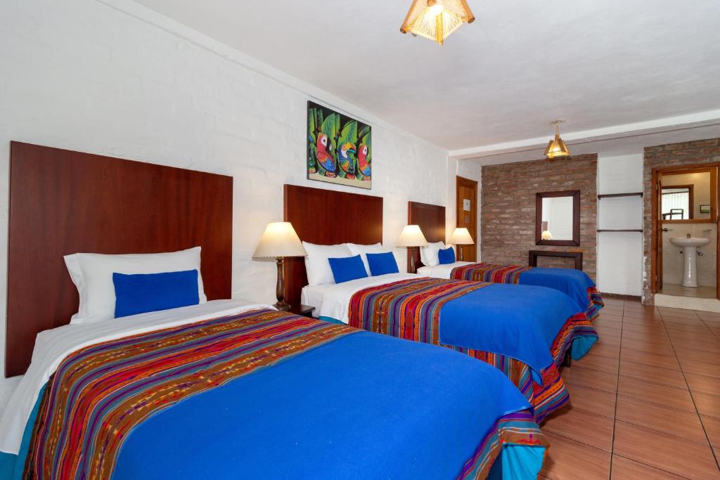 Postel nebo postele na pokoji v ubytování La Floresta Hotel