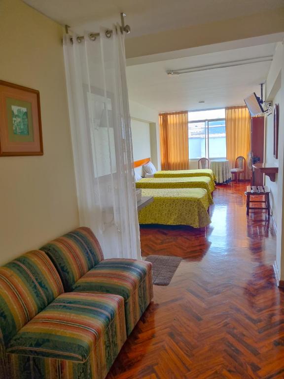 Postel nebo postele na pokoji v ubytování Hostal Solari