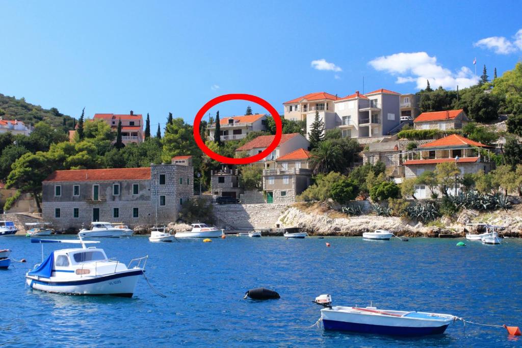 a group of boats in a body of water at Apartments with a parking space Prigradica, Korcula - 193 in Blato