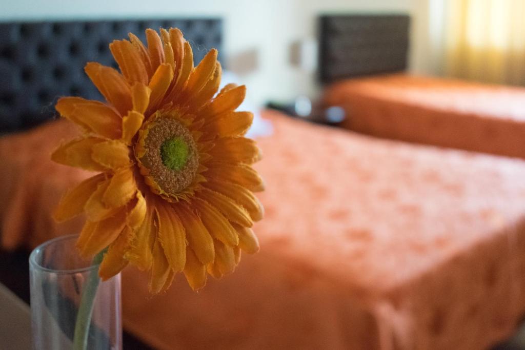 Postel nebo postele na pokoji v ubytování Hostal Solari