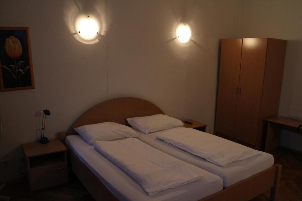 Postel nebo postele na pokoji v ubytování Suite Hotel 200m zum Prater