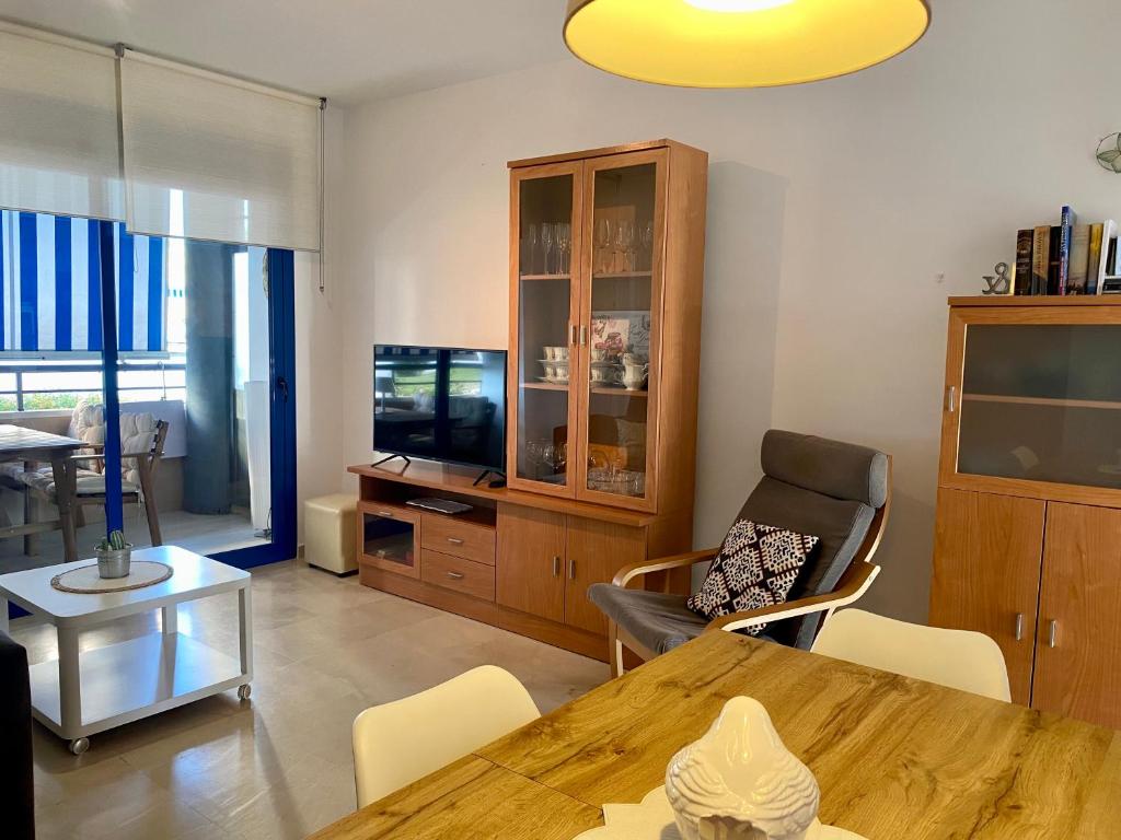 Televízia a/alebo spoločenská miestnosť v ubytovaní Tranquilidad y Relax