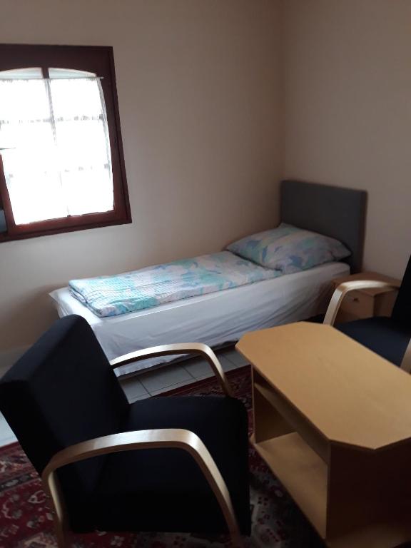 A bed or beds in a room at F 106 Vendégház