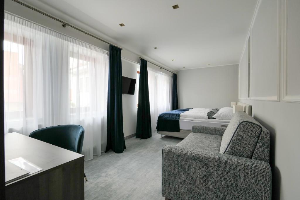 Postel nebo postele na pokoji v ubytování Hotel Zlatá Hvězda