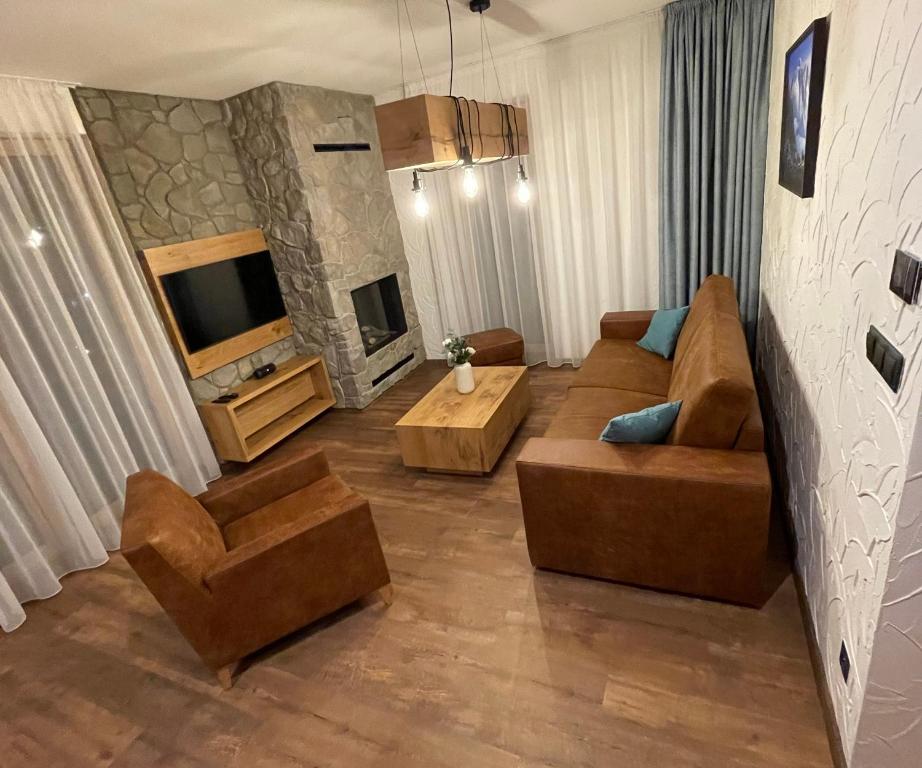 TV a/nebo společenská místnost v ubytování Ovruč Apartments Štrbské Pleso